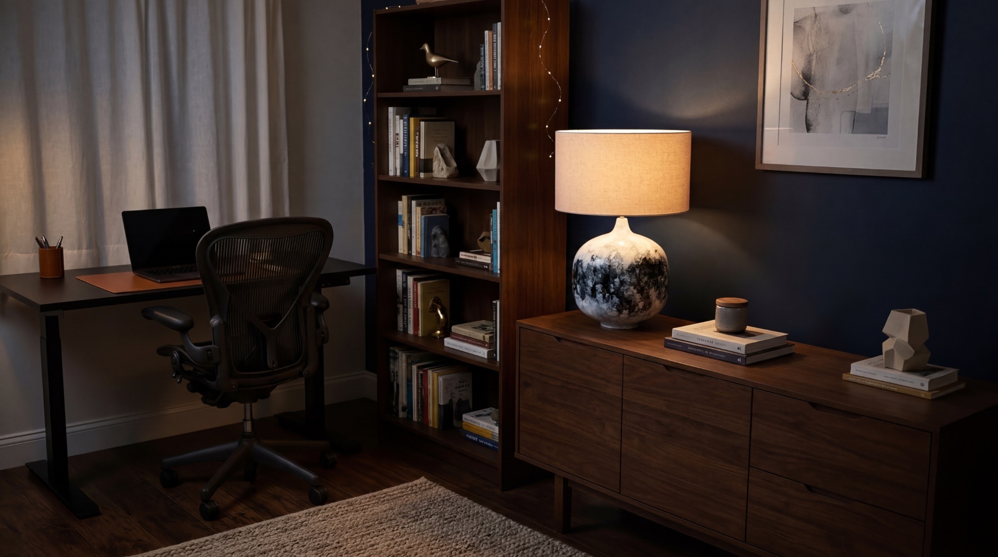 Abstract leaf canvas painting above a walnut home office desk with brass accessories