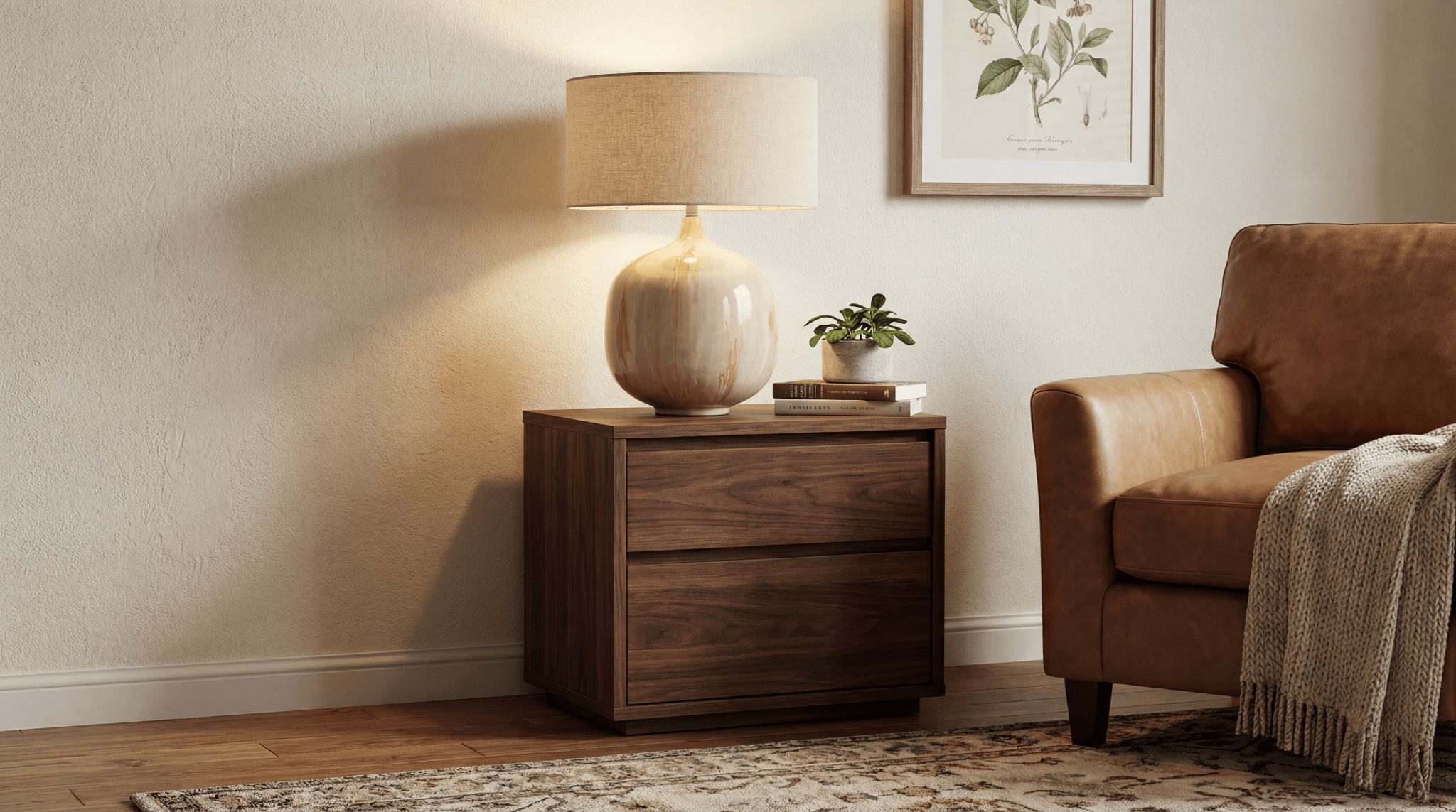 Ceramic table lamp with linen shade on a walnut side table in a warm living room setting